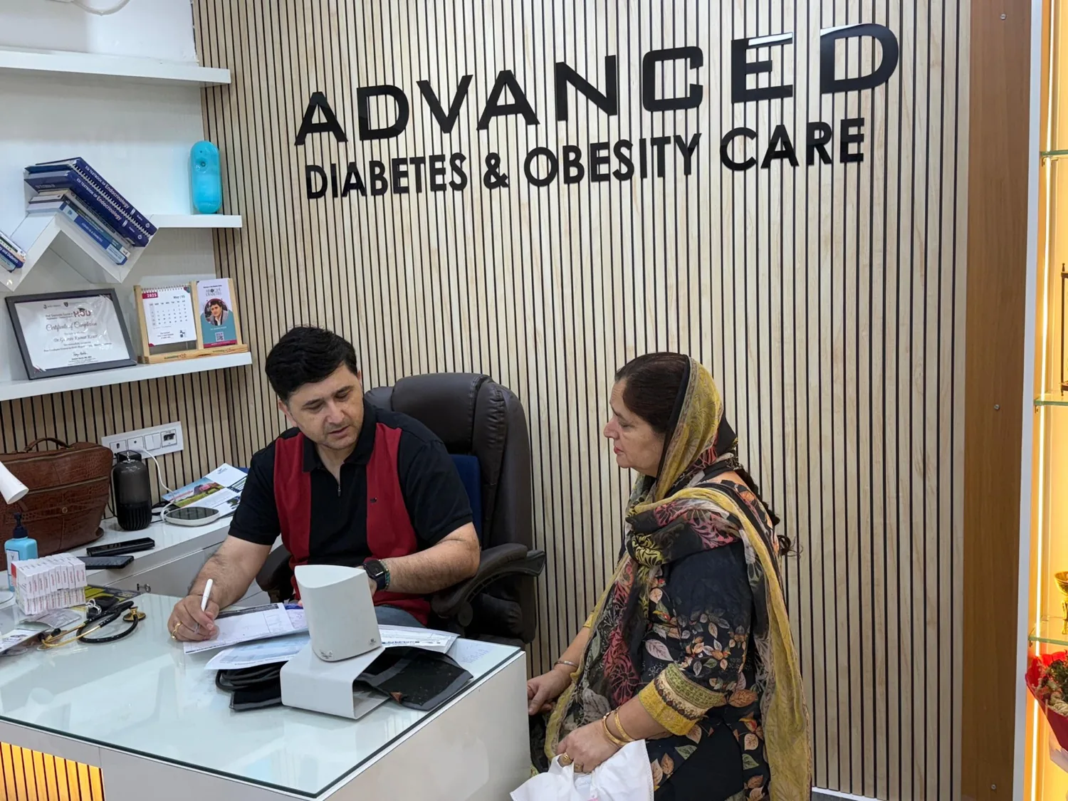 Dr. Gaurav K Kesar reviewing reports with a patient at MediHub Diabetes & Obesity Care, Jammu